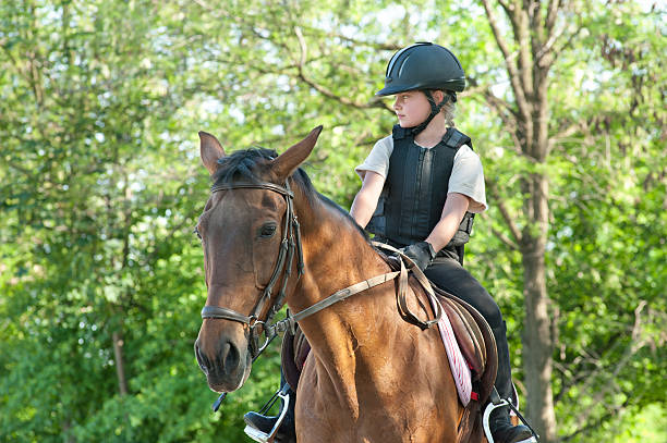 istock girl riding a horse 148998300