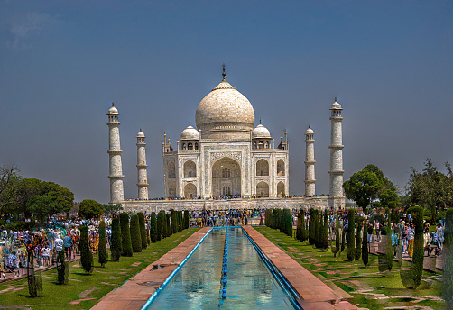 Architecture of the Taj Mahal as seen from the fountain. The Taj Mahal is an architectural masterpiece and one of the most iconic landmarks in the world.