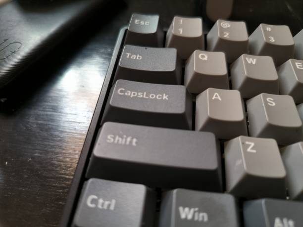 istock Photo a black keyboard on a wooden table 1489984542