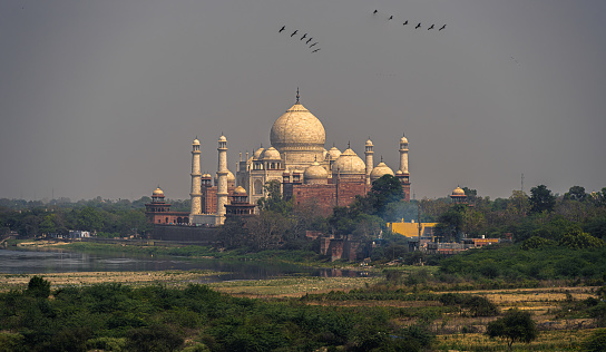 The Badshahi Mosque. The Royal Mosque is a Mughal-era congregational mosque in Lahore, capital of the Pakistani province of Punjab, Pakistan. The mosque is located west of Lahore Fort along the outskirts of the Walled City of Lahore, and is widely considered to be one of Lahore's most iconic landmarks. \nThe Badshahi Mosque was constructed by the Mughal emperor Aurangzeb between 1671 and 1673 and was the largest mosque in the world from 1673 to 1986. The mosque is an important example of Mughal architecture, with an exterior that is decorated with carved red sandstone with marble inlay. It remains the largest mosque of the Mughal-era, and is the third-largest mosque in Pakistan.  After the fall of the Mughal Empire, the mosque was used as a garrison by the British Empire, and is now one of Pakistan's most iconic sights.\n\nThe Royal Fort is Also located and built next to Royal Mosque. \n\nLahore is the capital of the Pakistani province of Punjab, is Pakistan's 2nd largest city after Karachi, and is the 26th largest city in the world. Lahore is the largest city of Punjab. Lahore is one of Pakistan's wealthiest cities with an estimated GDP (PPP) of $84 billion as of 2019. It is the largest city and historic cultural centre of the greater Punjab region, and is one of Pakistan's most socially liberal,  progressive, and cosmopolitan cities.