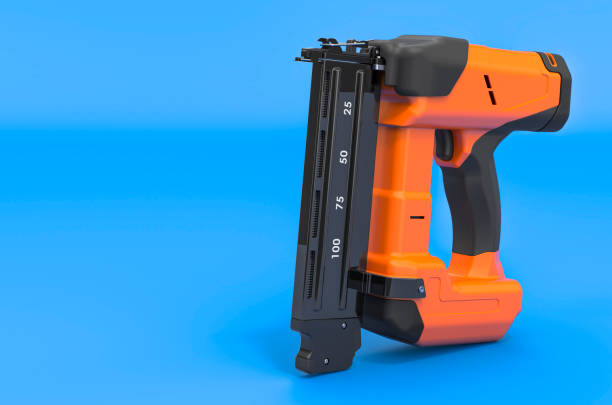 istock Electric Brad Nailer on blue backdrop, 3D rendering 1489987895