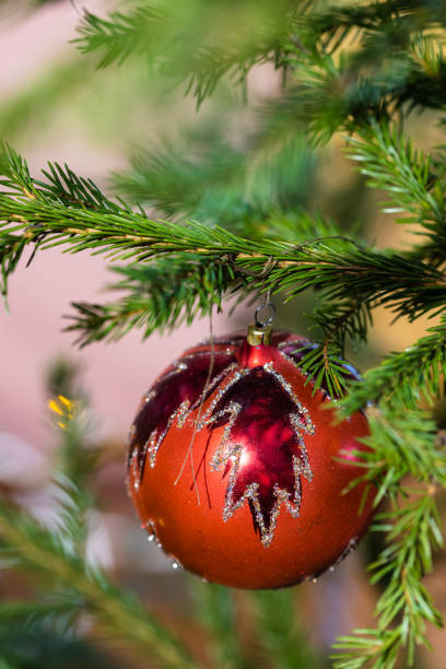 istock red glass ball with leaf image on christmas tree 1489989569