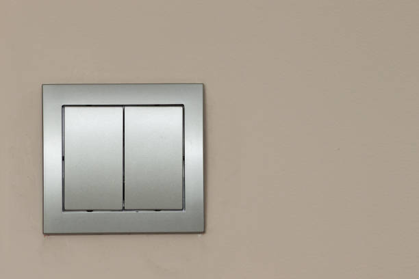 istock Light switch on wall. turn on or turn off the lights. Saving electric concept. Modern new light switch interior background 1489990972