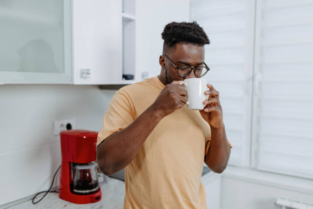 istock Young Man Brews Espresso on His Home Espresso Machine 1489992095