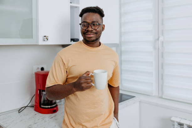 istock African American Man Brews Coffee on Home Espresso Machine 1489992097