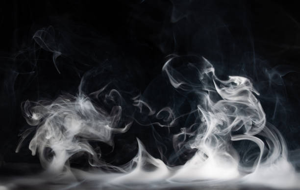 istock Abstract smoke on a dark background . Isolated . 1489992328