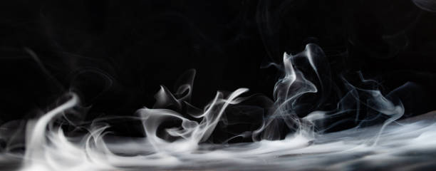 istock Abstract smoke on a dark background . Isolated . 1489992356