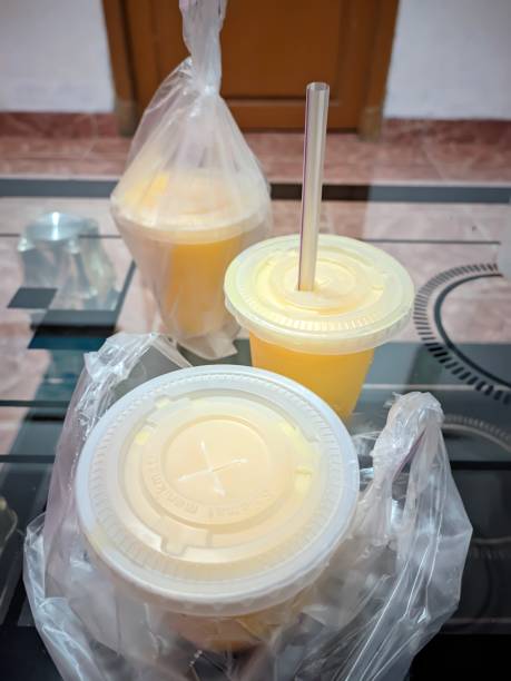 istock various mango fruit juices in plastic cups with straws on the table 1489996840