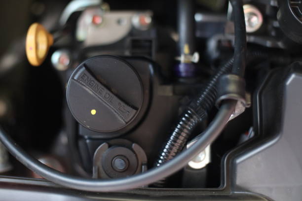 istock selective focus on the Engine oil cap installed on a car engine for maintenance service lubricant, automotive part concept. soft focus 1490003497
