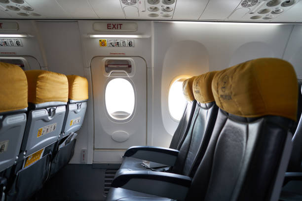 Emergency exit door in Nok Air Boeing 737-800 stock photo