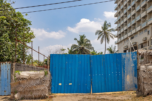 Negombo, Western Province, Sri Lanka - March 9th 2023:  Gate to a construction site where a new and fancy hotel are being built