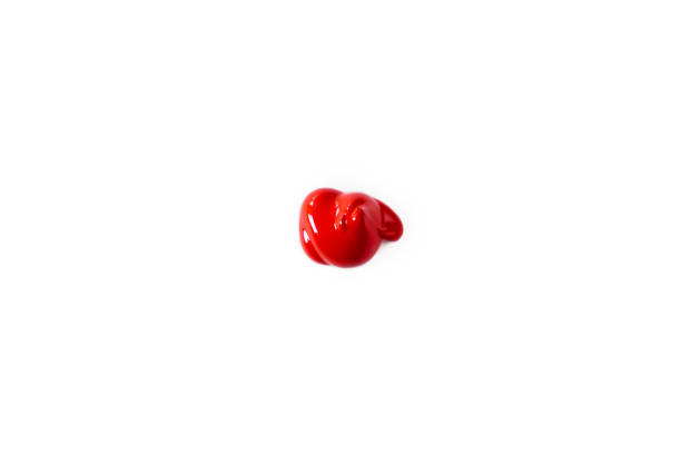 istock A drop of red color, as a sample on a white background. Top view, flat lay 1490015647