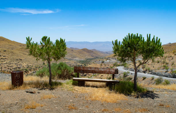 istock wooden bench on the mountain 1490017562