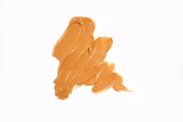 istock Make up smear foundation smudge texture white isolated background. Top view, flat lay 1490019312