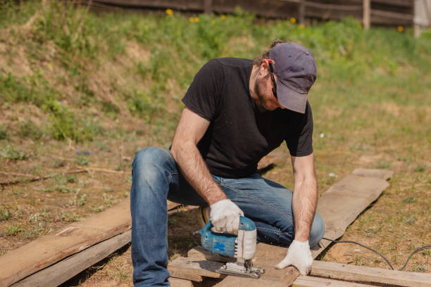istock An adult man is engaged in carpentry work at a house construction site 1490020046