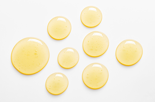 Yellow drops of gel close up. Cosmetic product for moisturizing the skin of the face or body