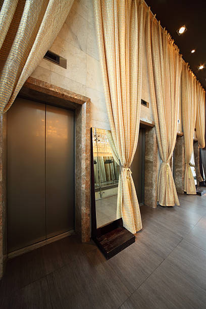 istock Several doors of lifts and curtains in hallway 149002947
