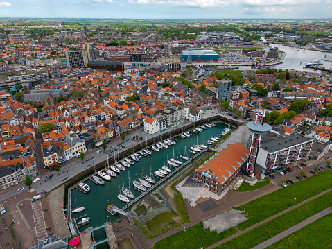 This aerial drone photo shows the harbour in the city center of Vlissingen. Vlissingen is a beautiful city at the coastline in Zeeland, the Netherlands.