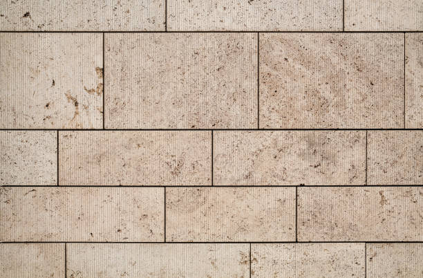 istock texture of a tiled beige stone wall as background, natural stone wall texture as background. 1490030190