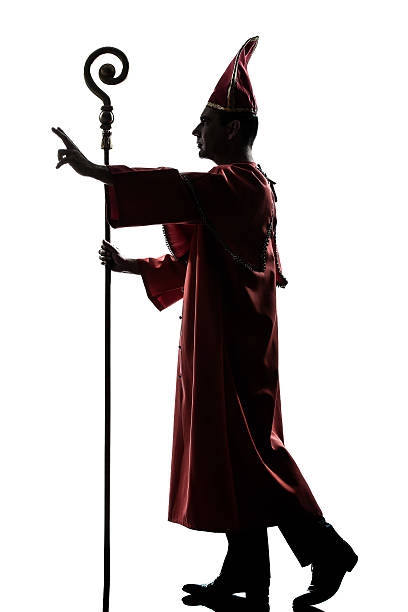 istock man cardinal bishop silhouette saluting blessing 149003134
