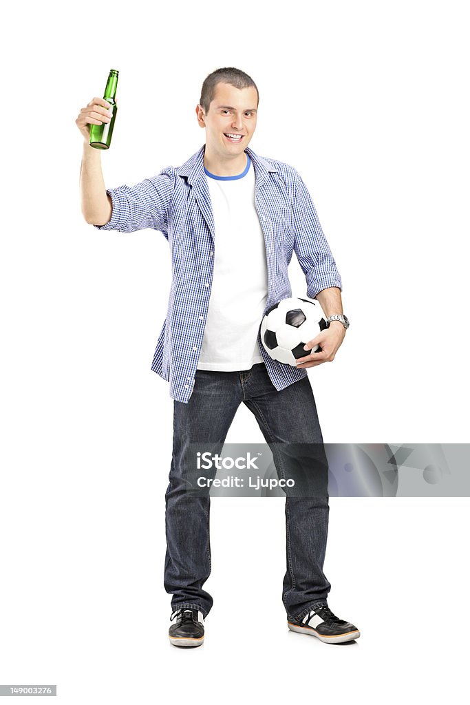 Guy holding football and beer Full length portrait of a male fan holding a football and beer bottle isolated on white 20-29 Years Stock Photo