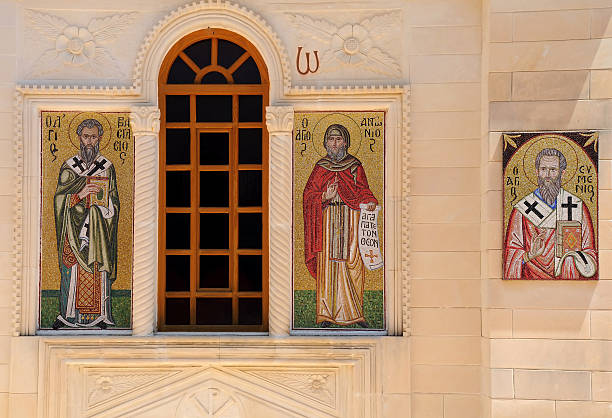 Mosaic Icons of Greek Orthodox Church Mosaic icons on the exterior of Greek Orthodox church on Crete island in Grece greek orthodox stock pictures, royalty-free photos & images