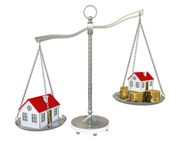 istock Large and small home with gold coins on the scale 149003775