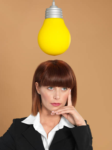 istock attractive, young businesswoman with light bulb, thinking 149003777