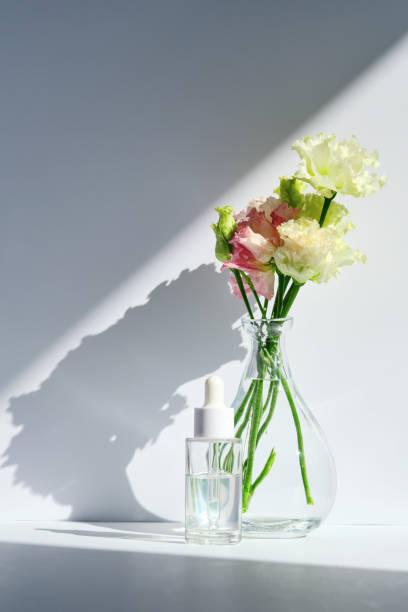 istock Serum with a dropper with spring flowers. 1490050078