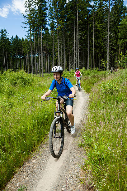 istock Two women riding bikes in forest 149005148