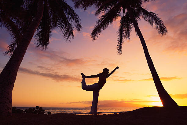 istock Woman Practicing Yoga at Sunset 149005184