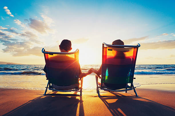 istock senior couple watching the sunset 149005186