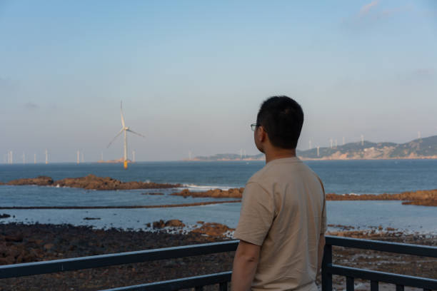 istock Tourists enjoy sea view at sunset 1490053040