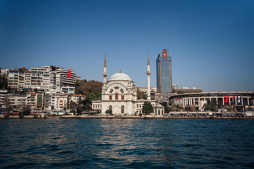 View of the Dolmabahce Mosque ( Bezmialem Valide Sultan Mosque) on the banks of the Bosphorus, Isanbul, Turkey