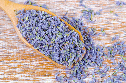 Close-up of dried lavender buds in a wooden spoon