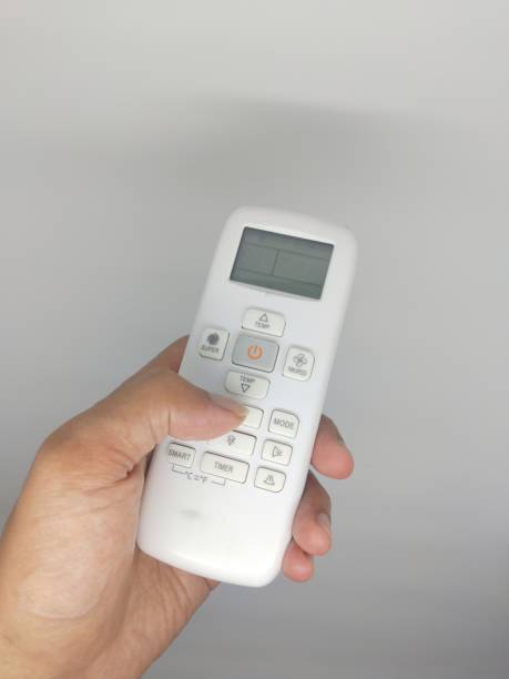 istock an air conditioner remote controller isolated on white background held by hand 1490054857