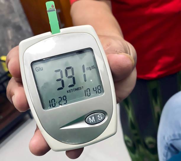 istock Someone's hand is showing a digital glucose test kit 1490058645