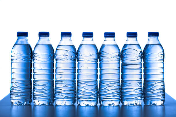 istock pile of half litre plastic water bottles with blue cap 1490058908