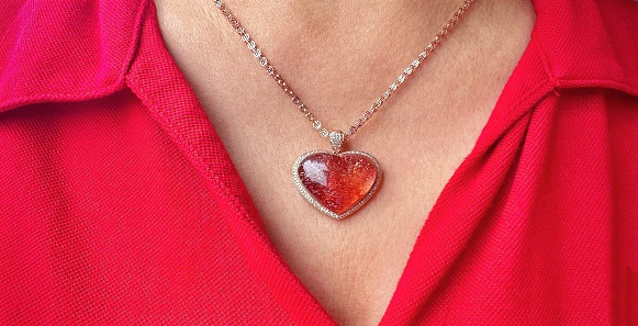 Silver chain and pendant in the shape of heart