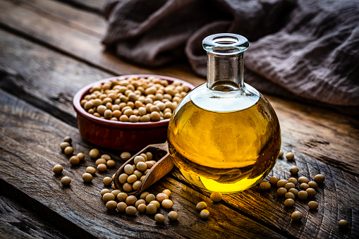 Soy oil bottle and dried soybeans