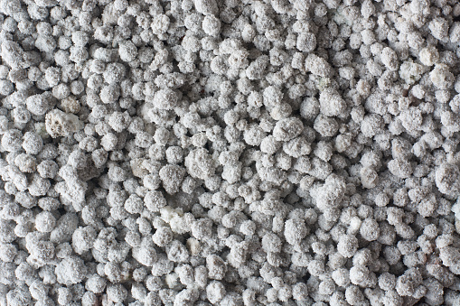 close-up of inorganic fertilizer, aka synthetic or chemical fertilizer, minerals like nitrogen, phosphorus and potassium needs for different plants and crops, taken in full frame background