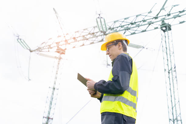 istock Engineer  on a background of power line tower 1490064719