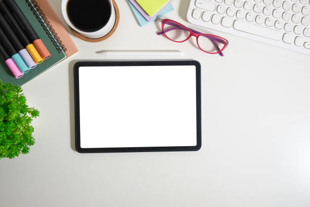 istock Digital tablet with empty screen on white working desk with office supplies. Copy space for your text. 1490064772