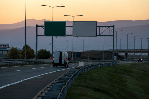 istock White delivery van on the highway. White modern delivery small shipment cargo courier van moving fast on motorway road to city urban suburb. The business distribution and logistics express service. 1490065012