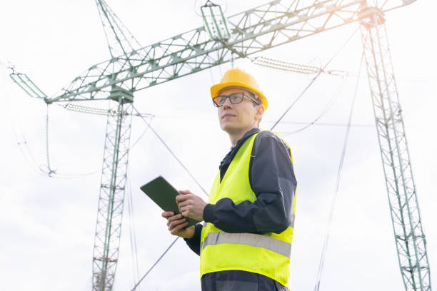 istock Engineer  on a background of power line tower 1490067240