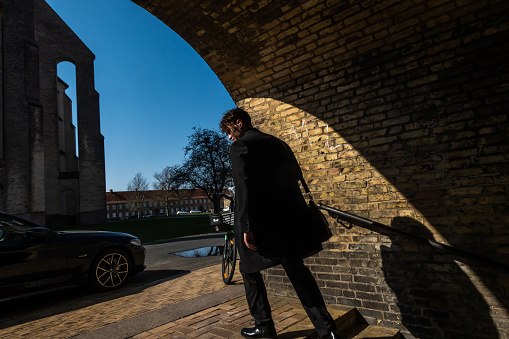 Copenhagen, Denmark April 17, 2023 A man  on old steps in the Bispebjerg district