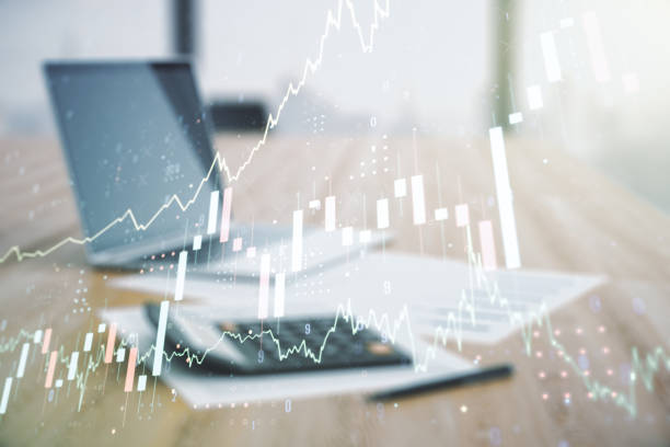 istock Double exposure of virtual creative financial diagram on calculator and pc background, banking and accounting concept 1490070101