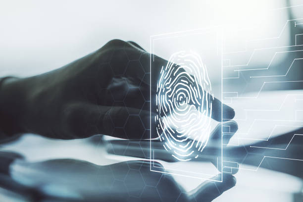 istock Multi exposure of creative fingerprint hologram with finger presses on a digital tablet on background, personal biometric data concept 1490070254