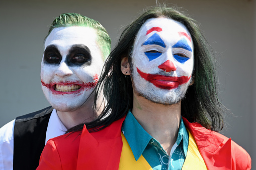 Dusseldorf, Germany, May 13, 2023 - A young man dressed as a joker at Japan Day in Dusseldorf - where thousands of cos-players gather on the lower banks of the Rhine for a street festival