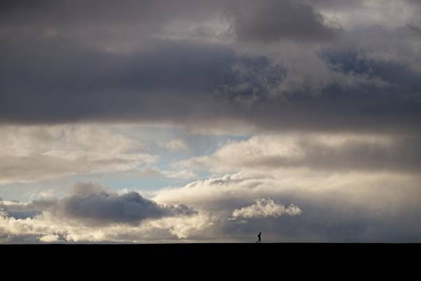 Lone person and sky landscape